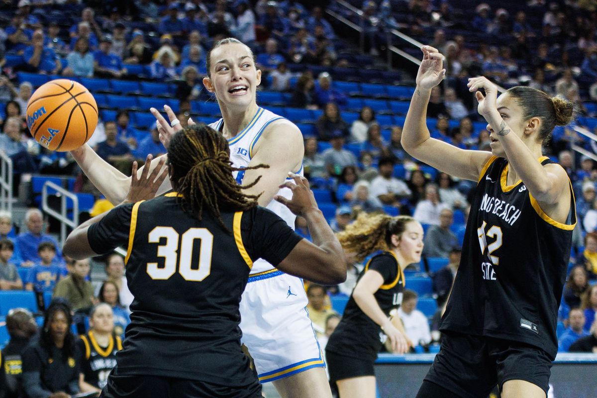 UCLA Bruins forward Angela Dugalić (32) attempts to pass the ball during an NCAA basketball game against the Long Beach State, Saturday December 20, 2025 in Los Angeles, Calif. UCLA Bruins forward Angela Dugalić (32) attempts to pass the ball during an NCAA basketball game against the Long Beach State, Saturday December 20, 2025 in Los Angeles, Calif.