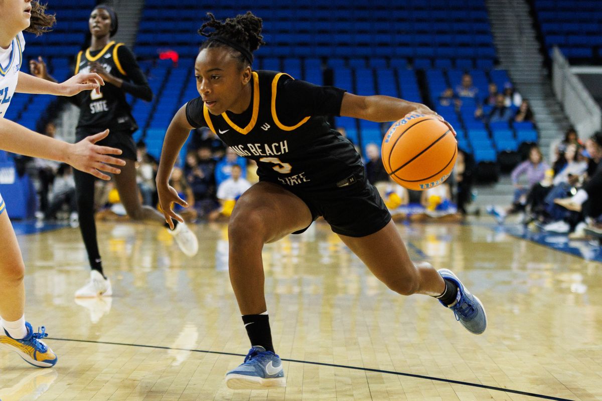 Long Beach State guard Tairat Samuel-Afolabi (3) drives in with the ball during an NCAA basketball game against the UCLA Bruins, Saturday December 20, 2025 in Los Angeles, Calif. Long Beach State guard Tairat Samuel-Afolabi (3) drives in with the ball during an NCAA basketball game against the UCLA Bruins, Saturday December 20, 2025 in Los Angeles, Calif.