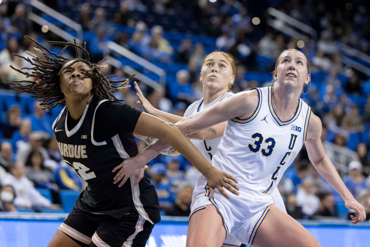 Kendall Puryear #22 of the Purdue Boilermakers and Amanda Muse #33 of the UCLA Bruins fight for a rebound during an NCAA basketball game, Wednesday January 21, 2026 in Los Angeles, Calif. Kendall Puryear #22 of the Purdue Boilermakers and Amanda Muse #33 of the UCLA Bruins fight for a rebound during an NCAA basketball game, Wednesday January 21, 2026 in Los Angeles, Calif.