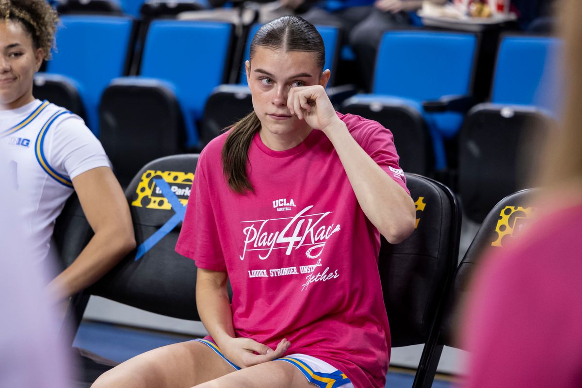Gabriela Jaquez #11 of the UCLA Bruins wipes away a tear on the bench prior to the Play4Kay Pink game supporting the fight against all cancers affecting women, February 15, 2026 in Los Angeles, Calif.
