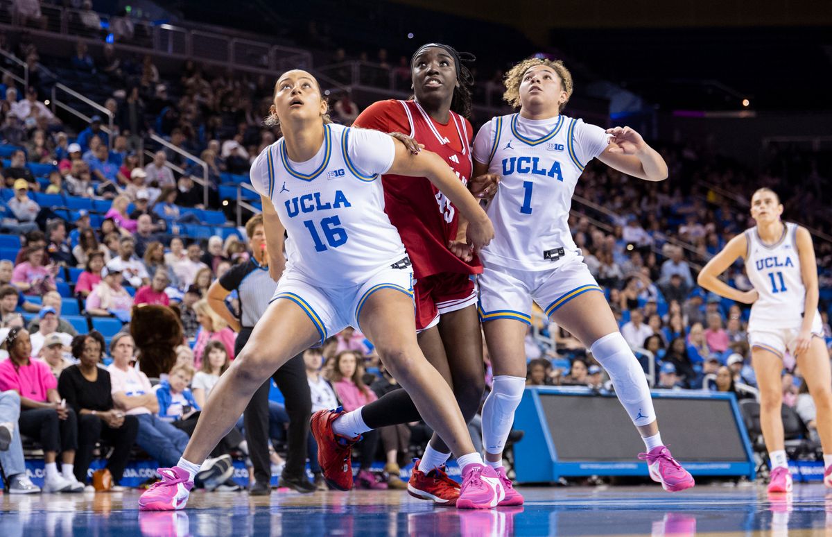 Sienna Betts #16 and Kiki Rice #1of the UCLA Bruins battle for a rebound with Jade Ondineme #45 of the Indiana Hoosiers during an NCAA basketball game, February 15, 2026 in Los Angeles, Calif.