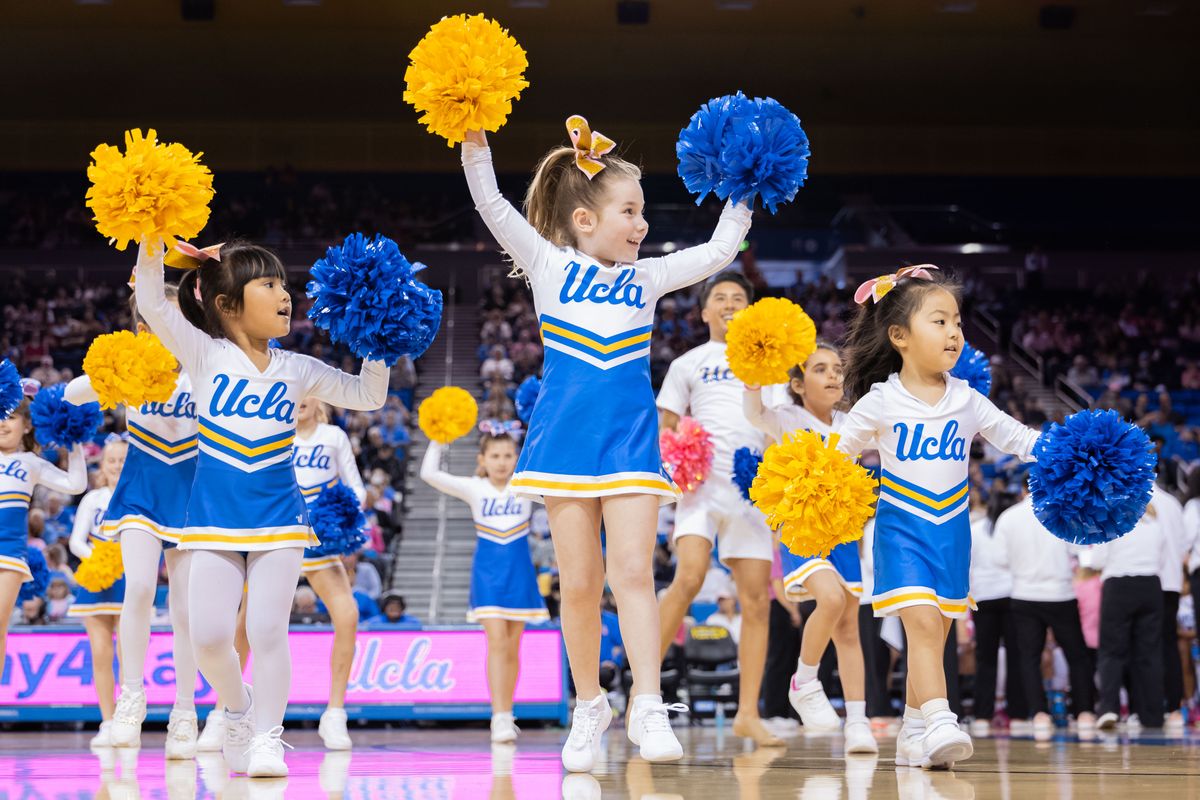 The UCLA Bruins Little Bruin Spirit cheerleaders perform on the court during an NCAA basketball game against the Indiana Hoosiers, February 15, 2026 in Los Angeles, Calif.
