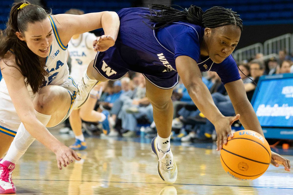 UCLA forward Angela Dugalic (32) dives for possession during a Big 10 basketball game against Washington, Thursday February 19th, 2026 in Los Angeles, California