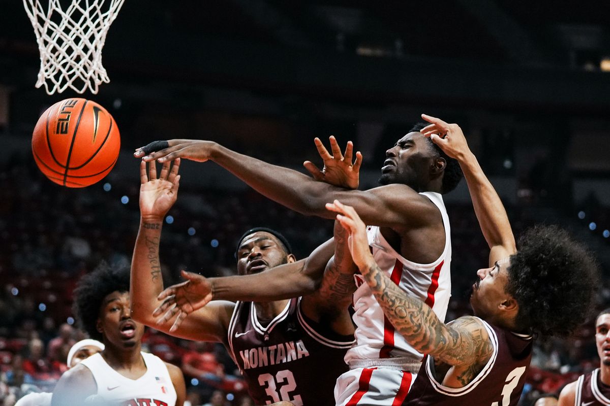 UNLV forward Kimani Hamilton (2) and Montana forward Te’Jon Sawyer (32) and guard Brooklyn Hicks (3) loose control of the ball during first half of college basketball game against Montana on Tuesday, Nov. 11, 2025 at Thomas and Mack Center in Las Vegas. UNLV forward Kimani Hamilton (2) and Montana forward Te’Jon Sawyer (32) and guard Brooklyn Hicks (3) loose control of the ball during first half of college basketball game against Montana on Tuesday, Nov. 11, 2025 at Thomas and Mack Center in Las Vegas.
