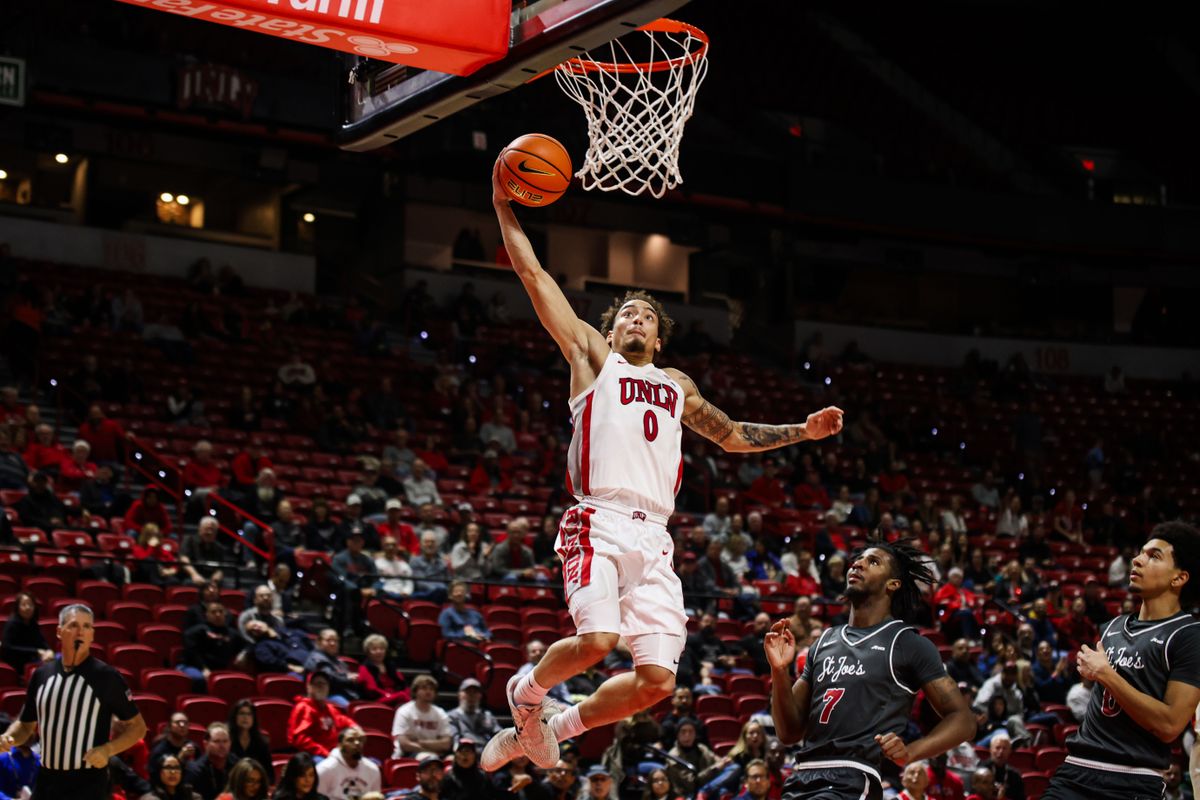 UNLV Runnin' Rebels G Dravyn Gibbs-Lawhorn (0) dunks the ball during an NCAA basketball game against the Saint Joseph's Hawks on Thursday November 20, 2025, in Las Vegas, Nevada. UNLV Runnin' Rebels G Dravyn Gibbs-Lawhorn (0) dunks the ball during an NCAA basketball game against the Saint Joseph's Hawks on Thursday November 20, 2025, in Las Vegas, Nevada.