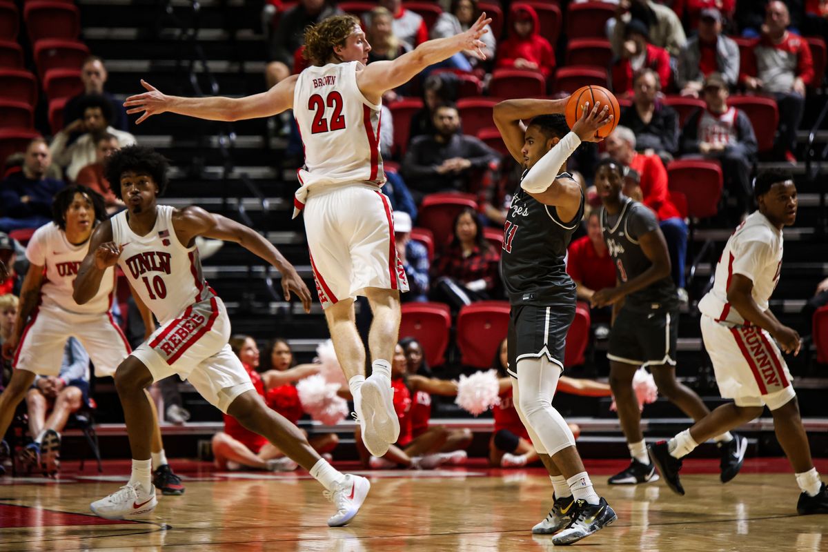 Saint Joseph's Hawks G Jaiden Glover-Toscano (11) looks for a pass against UNLV Runnin' Rebels F Walter Brown (22) during an NCAA basketball game on Thursday November 20, 2025, in Las Vegas, Nevada. Saint Joseph's Hawks G Jaiden Glover-Toscano (11) looks for a pass against UNLV Runnin' Rebels F Walter Brown (22) during an NCAA basketball game on Thursday November 20, 2025, in Las Vegas, Nevada.