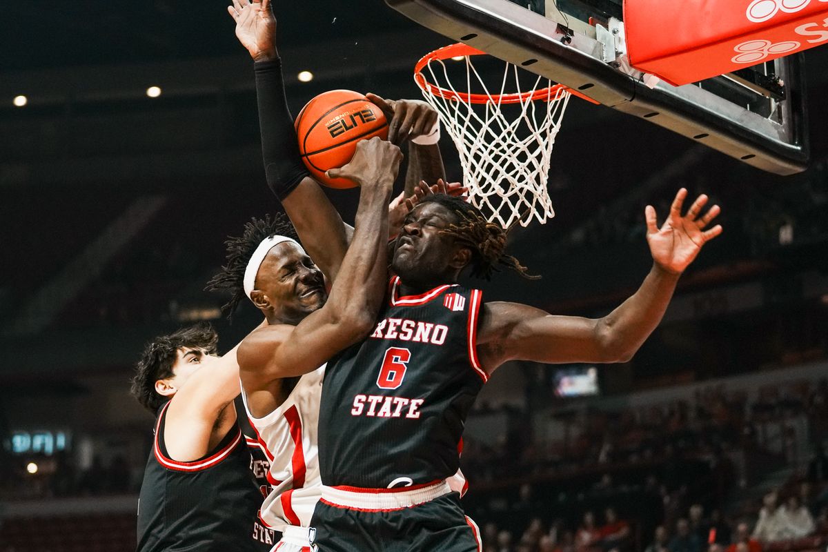 Fresno guard DJ Stickman (6), center Wilson Jacques (16) and UNLV center Emmannuel Stephen (34) reach to rebound the ball during first half of college basketball game against UNLV on Sat., Dec. 20, 2025, at Thomas & Mack Center in Las Vegas. Fresno guard DJ Stickman (6), center Wilson Jacques (16) and UNLV center Emmannuel Stephen (34) reach to rebound the ball during first half of college basketball game against UNLV on Sat., Dec. 20, 2025, at Thomas & Mack Center in Las Vegas.