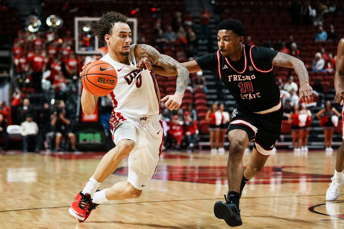 UNLV guard Dravyn Gibbs-Lawhorn (0) drives towards the basket while guarded by Fresno Zaon Collins (10) during second half of college basketball game against Fresno State on Sat., Dec. 20, 2025, at Thomas & Mack Center in Las Vegas. UNLV guard Dravyn Gibbs-Lawhorn (0) drives towards the basket while guarded by Fresno Zaon Collins (10) during second half of college basketball game against Fresno State on Sat., Dec. 20, 2025, at Thomas & Mack Center in Las Vegas.