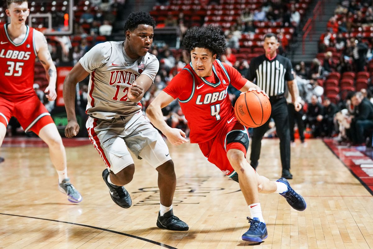 New Mexico guard Uriah Tenette (4) takes the ball down the court while guarded by UNLV Issac Williamson (12) during second half of college basketball game against UNLV on Tuesday, January 27, 2026 at Thomas & Mack Arena in Las Vegas. New Mexico guard Uriah Tenette (4) takes the ball down the court while guarded by UNLV Issac Williamson (12) during second half of college basketball game against UNLV on Tuesday, January 27, 2026 at Thomas & Mack Arena in Las Vegas.