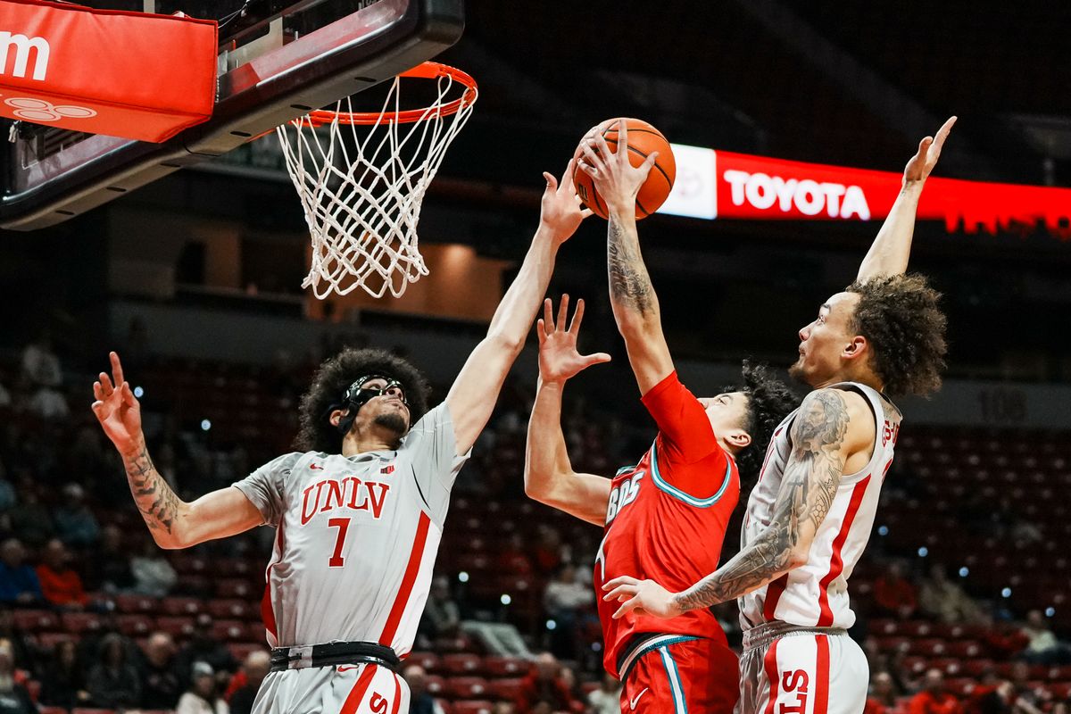 UNLV guard Dray Gibbs-Lawhorn (0) and Al green (7) attempt to block a shot from New Mexico Uriah Tenette (4) during second half of college basketball game against New Mexico on Tuesday, January 27, 2026 at Thomas & Mack Arena in Las Vegas.UNLV guard Dray Gibbs-Lawhorn (0) and Al green (7) attempt to block a shot from New Mexico Uriah Tenette (4) during second half of college basketball game against New Mexico on Tuesday, January 27, 2026 at Thomas & Mack Arena in Las Vegas. UNLV guard Dray Gibbs-Lawhorn (0) and Al green (7) attempt to block a shot from New Mexico Uriah Tenette (4) during second half of college basketball game against New Mexico on Tuesday, January 27, 2026 at Thomas & Mack Arena in Las Vegas.UNLV guard Dray Gibbs-Lawhorn (0) and Al green (7) attempt to block a shot from New Mexico Uriah Tenette (4) during second half of college basketball game against New Mexico on Tuesday, January 27, 2026 at Thomas & Mack Arena in Las Vegas.