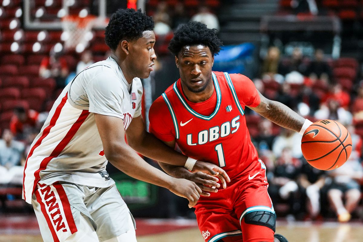 New Mexico guard Deyton Albury (1) drives towards the basket while guarded by UNLV Issac Williamson (12) during second half of college basketball game against UNLV on Tuesday, January 27, 2026 at Thomas & Mack Arena in Las Vegas. New Mexico guard Deyton Albury (1) drives towards the basket while guarded by UNLV Issac Williamson (12) during second half of college basketball game against UNLV on Tuesday, January 27, 2026 at Thomas & Mack Arena in Las Vegas.