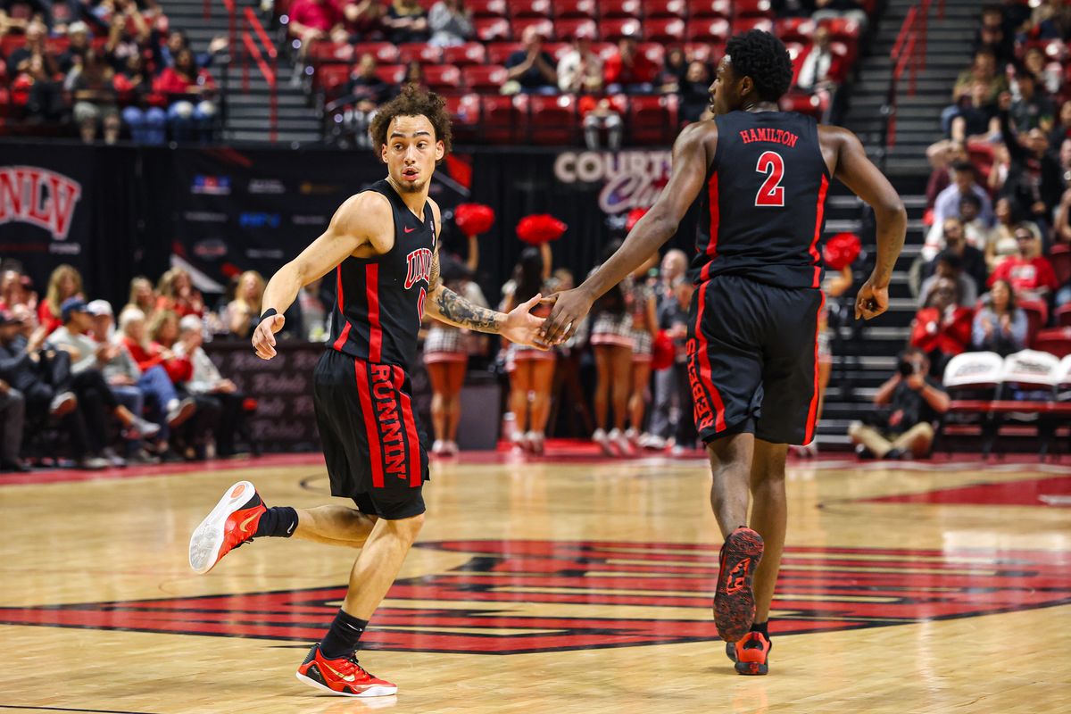 UNLV Runnin' Rebels G Dravyn Gibbs-Lawhorn (0) and teammate F Kimani Hamilton (2) high five after a basket was scored against the Grand Canyon Antelopes on Saturday February 7, 2026, in Las Vegas, Nevada. UNLV Runnin' Rebels G Dravyn Gibbs-Lawhorn (0) and teammate F Kimani Hamilton (2) high five after a basket was scored against the Grand Canyon Antelopes on Saturday February 7, 2026, in Las Vegas, Nevada.