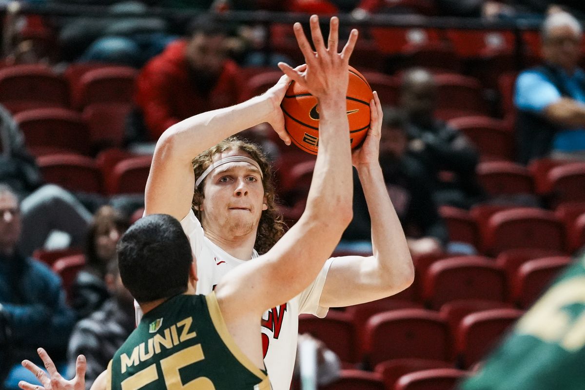 UNLV forward Walter Brown (22) attempts to pass the ball over Colorado State guard Kevin Muniz (55) during first half of college basketball game against Colorado State on Wednesday, Feb. 18, 2026 at Thomas & Mack Center in Las Vegas. UNLV forward Walter Brown (22) attempts to pass the ball over Colorado State guard Kevin Muniz (55) during first half of college basketball game against Colorado State on Wednesday, Feb. 18, 2026 at Thomas & Mack Center in Las Vegas.