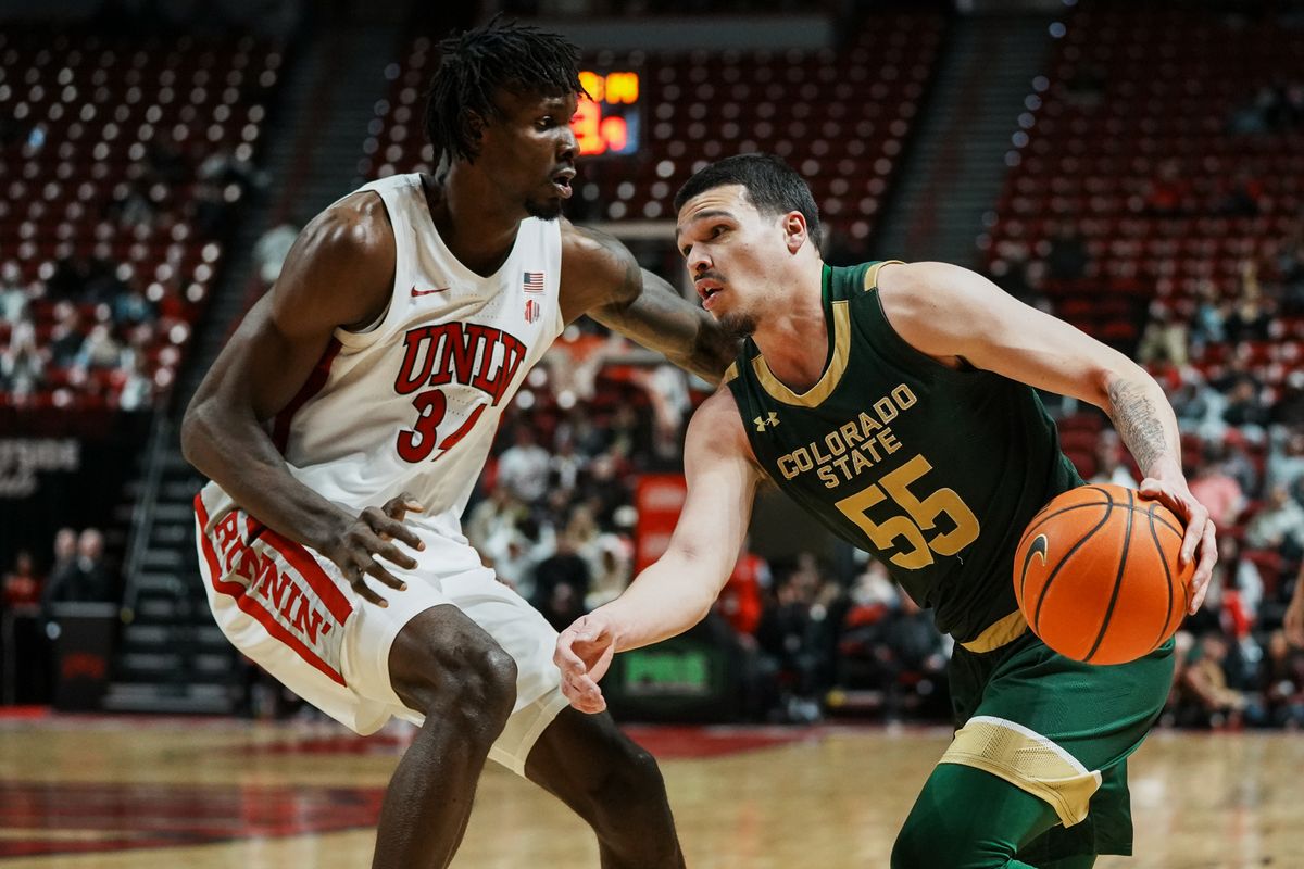 Colorado State guard Jevin Muniz (55) drives towards the basket while guarded by UNLC center Emmanuel Stephen (34) during second half of college basketball game against UNLV on Wednesday, Feb. 18, 2026 at Thomas & Mack Arena in Las Vegas. Colorado State guard Jevin Muniz (55) drives towards the basket while guarded by UNLC center Emmanuel Stephen (34) during second half of college basketball game against UNLV on Wednesday, Feb. 18, 2026 at Thomas & Mack Arena in Las Vegas.