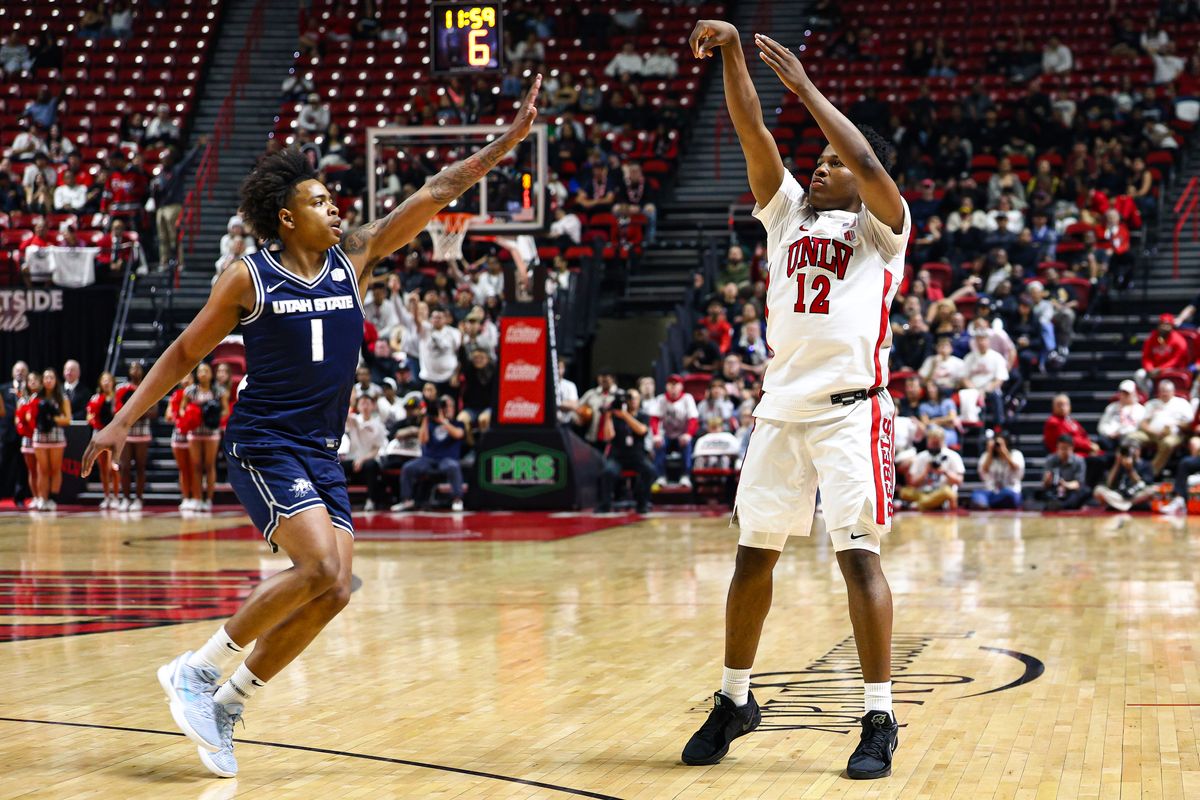 UNLV Runnin' Rebels G Issac Williamson (12) follows through on a three-point shot against the Utah State Aggies on Tuesday March 3, 2026, in Las Vegas, Nevada. UNLV Runnin' Rebels G Issac Williamson (12) follows through on a three-point shot against the Utah State Aggies on Tuesday March 3, 2026, in Las Vegas, Nevada.