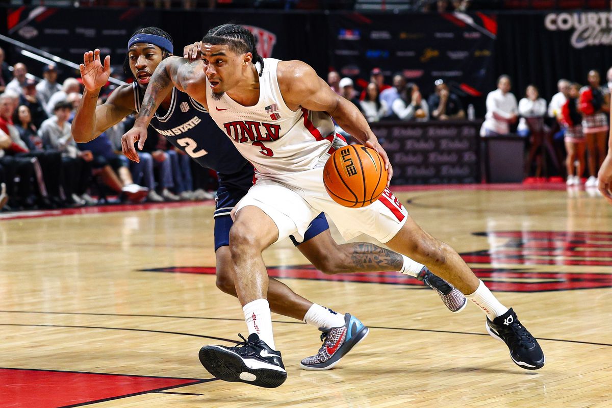UNLV Runnin' Rebels senior G Howie Fleming Jr. (3) battles for position against a Utah State Aggies player on Tuesday March 3, 2026, in Las Vegas, Nevada. UNLV Runnin' Rebels senior G Howie Fleming Jr. (3) battles for position against a Utah State Aggies player on Tuesday March 3, 2026, in Las Vegas, Nevada.