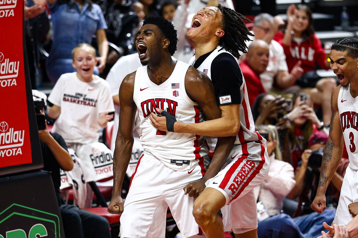 UNLV Runnin' Rebels senior F Kimani Hamilton and teammate F Tyrin Jones (6) celebrate after Hamilton earns a free throw shot after scoring a basket against the Utah State Aggies on Tuesday March 3, 2026, in Las Vegas, Nevada. UNLV Runnin' Rebels senior F Kimani Hamilton and teammate F Tyrin Jones (6) celebrate after Hamilton earns a free throw shot after scoring a basket against the Utah State Aggies on Tuesday March 3, 2026, in Las Vegas, Nevada.