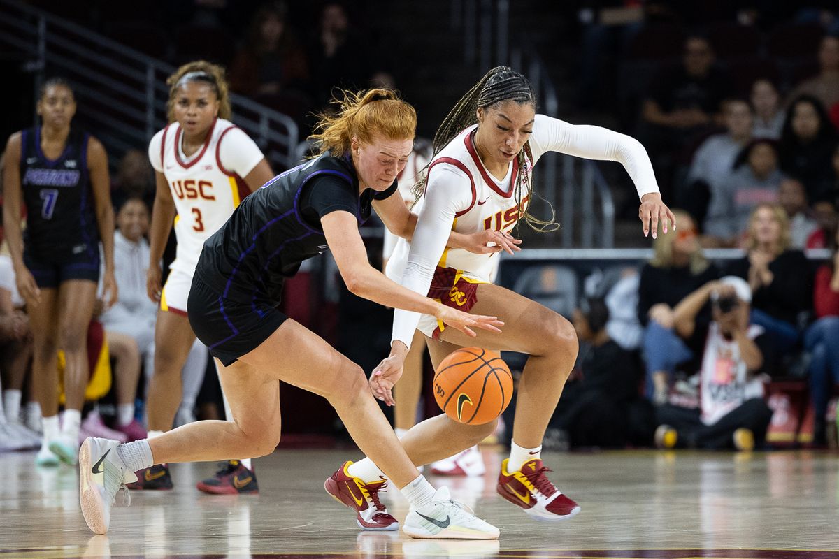 USC guard Kennedy Smith (11) steals the ball during a Big Ten college basketball game against the Portland Pilots, Tuesday November 18, 2025 in Los Angeles. USC guard Kennedy Smith (11) steals the ball during a Big Ten college basketball game against the Portland Pilots, Tuesday November 18, 2025 in Los Angeles.