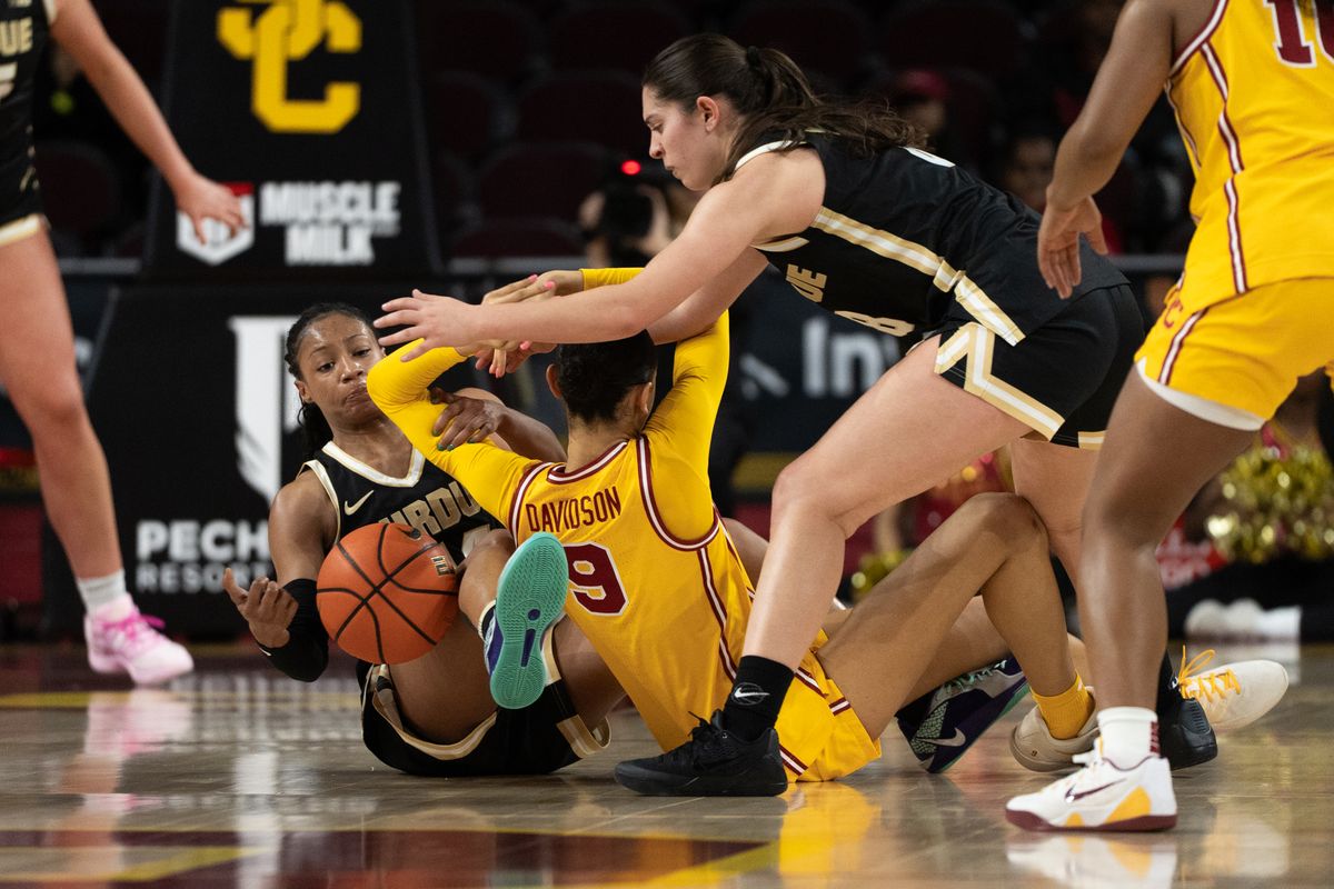 USC Trojans Guard Jazzy Davidson (9) scrambles on the ground for a loose ball during a women's college basketball game against the Purdue Boilermakers, Sunday January 18th, 2026 at Galen Center in Los Angeles, Calif. USC Trojans Guard Jazzy Davidson (9) scrambles on the ground for a loose ball during a women's college basketball game against the Purdue Boilermakers, Sunday January 18th, 2026 at Galen Center in Los Angeles, Calif.