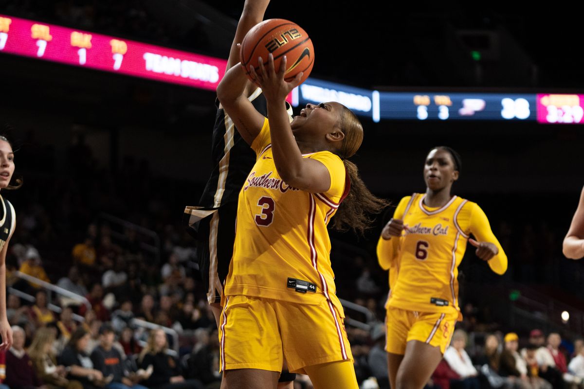 USC Trojans Guard Londynn Jones (3) jumps into her defender on her way to the rim during a women's college basketball game against the Purdue Boilermakers, Sunday January 18th, 2026 at Galen Center in Los Angeles, Calif. USC Trojans Guard Londynn Jones (3) jumps into her defender on her way to the rim during a women's college basketball game against the Purdue Boilermakers, Sunday January 18th, 2026 at Galen Center in Los Angeles, Calif.