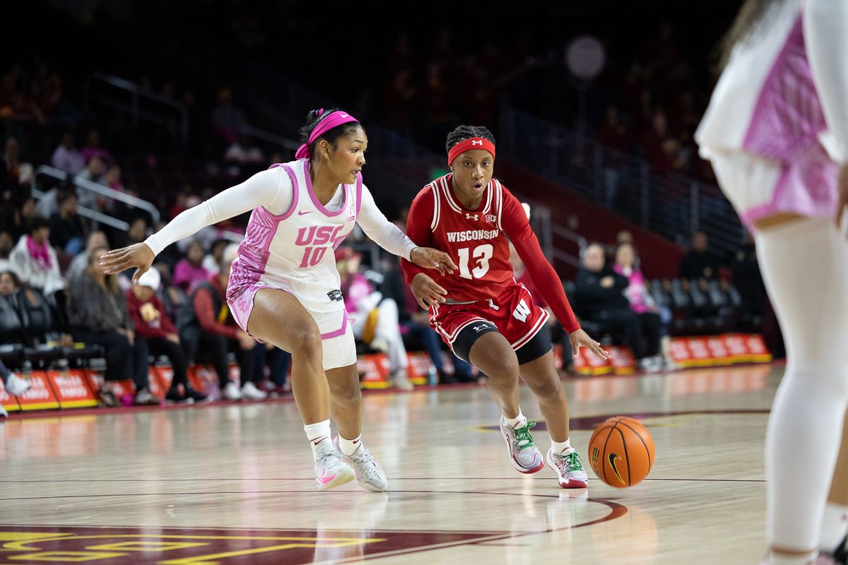 USC guard Malia Samuels (10) defends past defense during a Big Ten college basketball game against the Wisconsin Badgers, Thursday February 19, 2026  in Los Angeles.