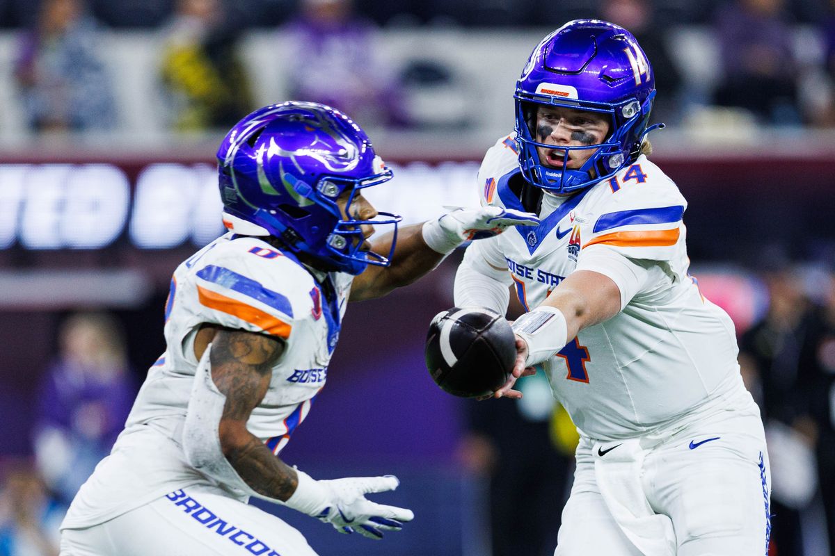 Boise State Broncos quarterback Maddux Madsen (4) hands the ball to running back Malik Sherrod (8) during the LA Bowl against the Washington Huskies on December 13, 2025 in Los Angeles, California. Boise State Broncos quarterback Maddux Madsen (4) hands the ball to running back Malik Sherrod (8) during the LA Bowl against the Washington Huskies on December 13, 2025 in Los Angeles, California.