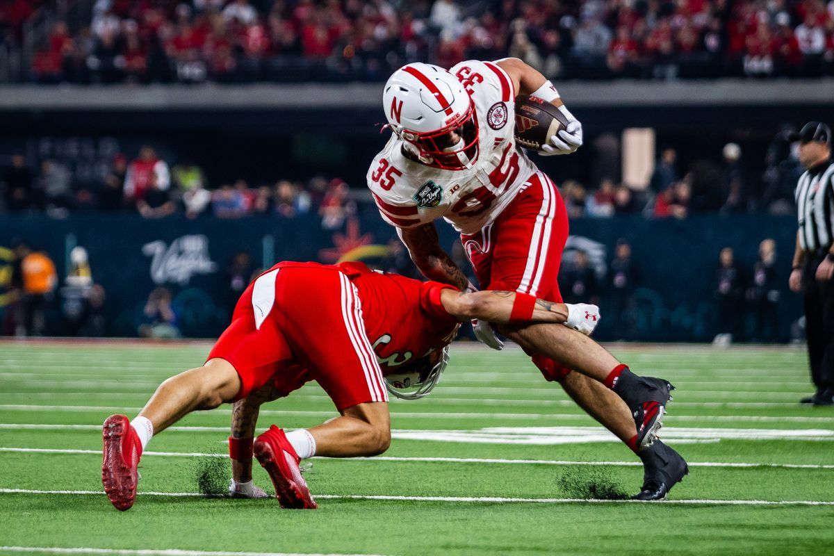 Nebraska Huskers running back Mehki Nelson (35) runs with the ball as Utah Utes defender tries to tackle him during the SRS Distribution Las Vegas Bowl game between the Nebraska Huskers and the Utah Utes, Sunday December 31, 2025 in Las Vegas, Nev. Nebraska Huskers running back Mehki Nelson (35) runs with the ball as Utah Utes defender tries to tackle him during the SRS Distribution Las Vegas Bowl game between the Nebraska Huskers and the Utah Utes, Sunday December 31, 2025 in Las Vegas, Nev.