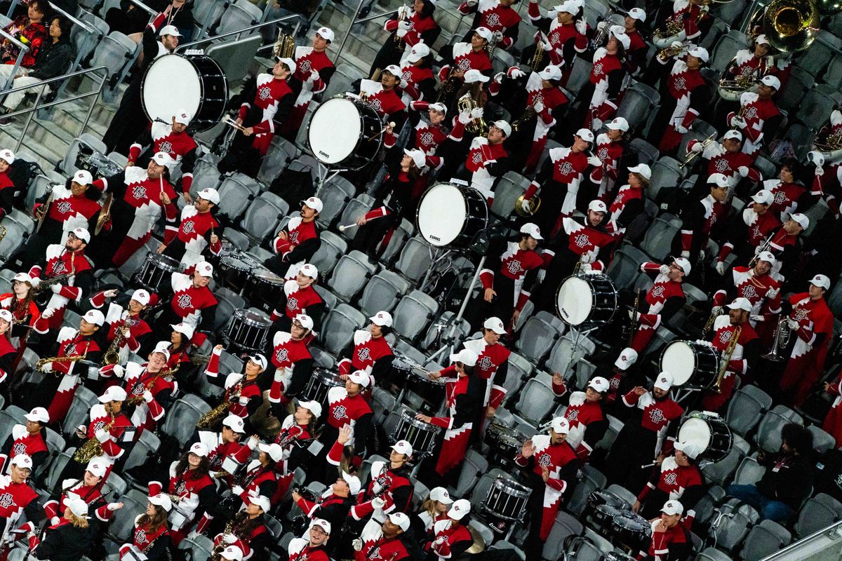 The San Diego State marching band dances in the stands during an NCAA Football game between San Jose State and San Diego State, Saturday November 22, 2025 in San Diego, Calif. The San Diego State marching band dances in the stands during an NCAA Football game between San Jose State and San Diego State, Saturday November 22, 2025 in San Diego, Calif.