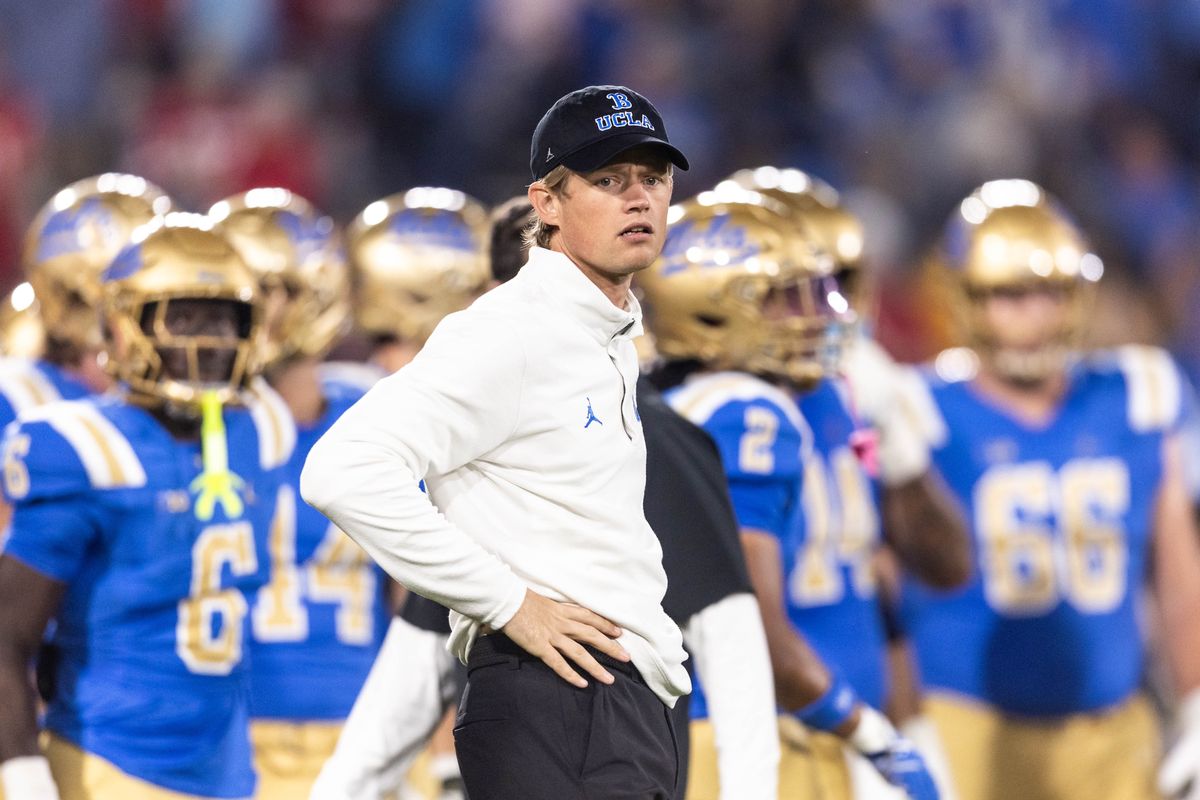 UCLA Bruins offensive coordinator Jerry Neuheisel prepares before the game against Nebraska Cornhuskers at Rose Bowl Stadium on November 8, 2025 in Pasadena, California. UCLA Bruins offensive coordinator Jerry Neuheisel prepares before the game against Nebraska Cornhuskers at Rose Bowl Stadium on November 8, 2025 in Pasadena, California.