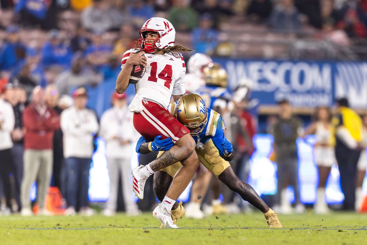 UCLA Bruins defensive back Key Lawrence (4) sacks Nebraska Cornhuskers quarterback TJ Lateef (14) during the game against Nebraska Cornhuskers at Rose Bowl Stadium on November 8, 2025 in Pasadena, California. UCLA Bruins defensive back Key Lawrence (4) sacks Nebraska Cornhuskers quarterback TJ Lateef (14) during the game against Nebraska Cornhuskers at Rose Bowl Stadium on November 8, 2025 in Pasadena, California.