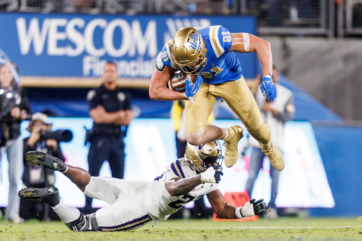 UCLA Bruins tight end Hudson Habermehl (81) attempts to hurdle while running the ball during the game against Washington Huskies at Rose Bowl Stadium on November 22, 2025 in Pasadena, California. UCLA Bruins tight end Hudson Habermehl (81) attempts to hurdle while running the ball during the game against Washington Huskies at Rose Bowl Stadium on November 22, 2025 in Pasadena, California.