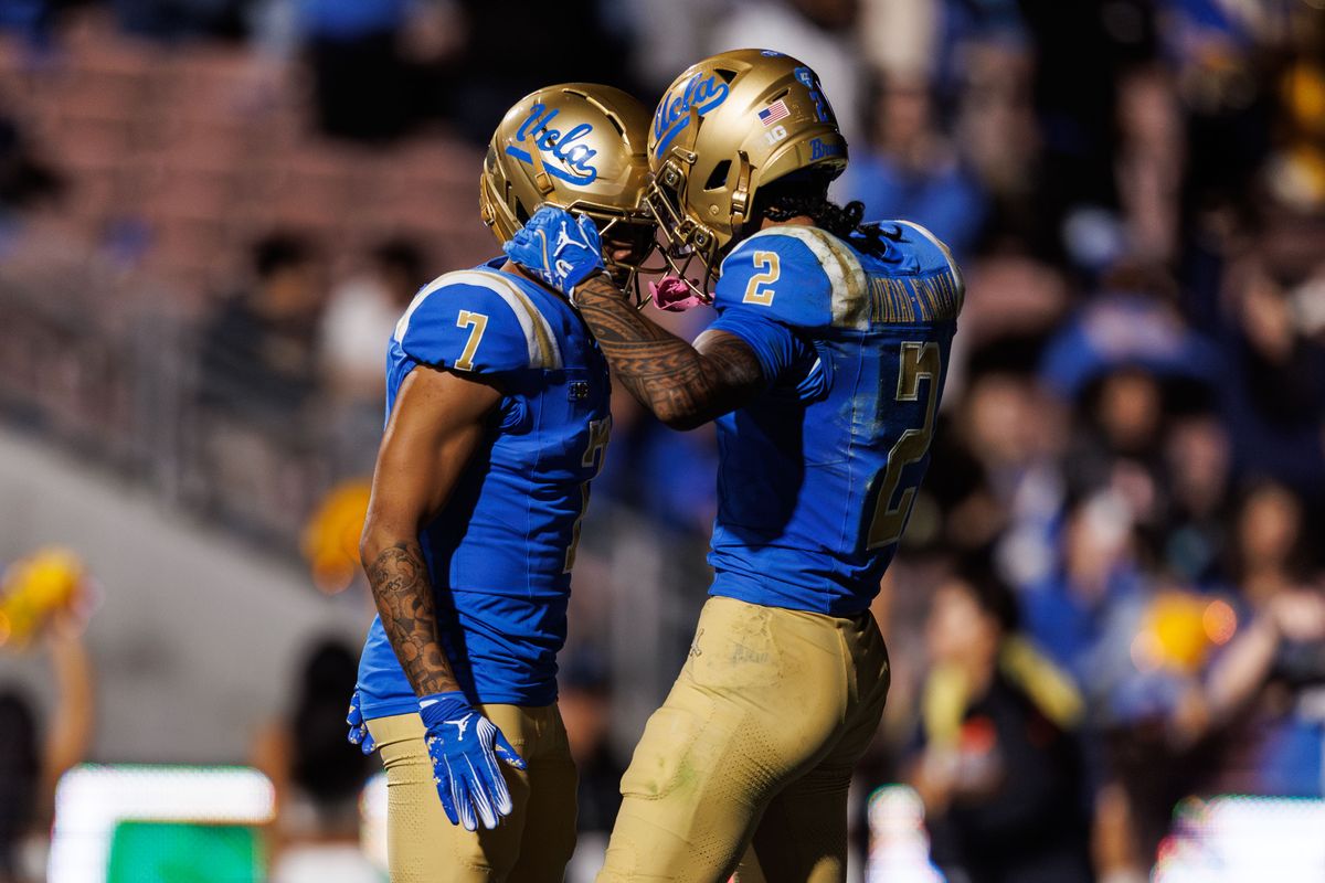 UCLA Bruins wide receiver Mikey Matthews (7) celebrates touchdown with UCLA Bruins wide receiver Titus Mokiao-Atimalala (2) during the game against Washington Huskies at Rose Bowl Stadium on November 22, 2025 in Pasadena, California. UCLA Bruins wide receiver Mikey Matthews (7) celebrates touchdown with UCLA Bruins wide receiver Titus Mokiao-Atimalala (2) during the game against Washington Huskies at Rose Bowl Stadium on November 22, 2025 in Pasadena, California.