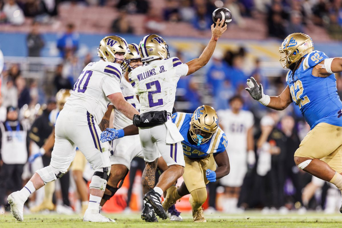 UCLA Bruins defensive lineman Cole Cogshell (24) goes for the sack on Washington Huskies quarterback Demond Williams Jr. (2) during the game against Washington Huskies at Rose Bowl Stadium on November 22, 2025 in Pasadena, California. UCLA Bruins defensive lineman Cole Cogshell (24) goes for the sack on Washington Huskies quarterback Demond Williams Jr. (2) during the game against Washington Huskies at Rose Bowl Stadium on November 22, 2025 in Pasadena, California.