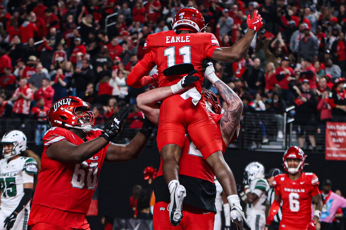 UNLV Rebels WR JoJo Earle (11) celebrates with his teammates after scoring a touchdown against the Hawai'i Rainbow Warriors on Friday November 21, 2025, in Las Vegas, Nevada. UNLV Rebels WR JoJo Earle (11) celebrates with his teammates after scoring a touchdown against the Hawai'i Rainbow Warriors on Friday November 21, 2025, in Las Vegas, Nevada.