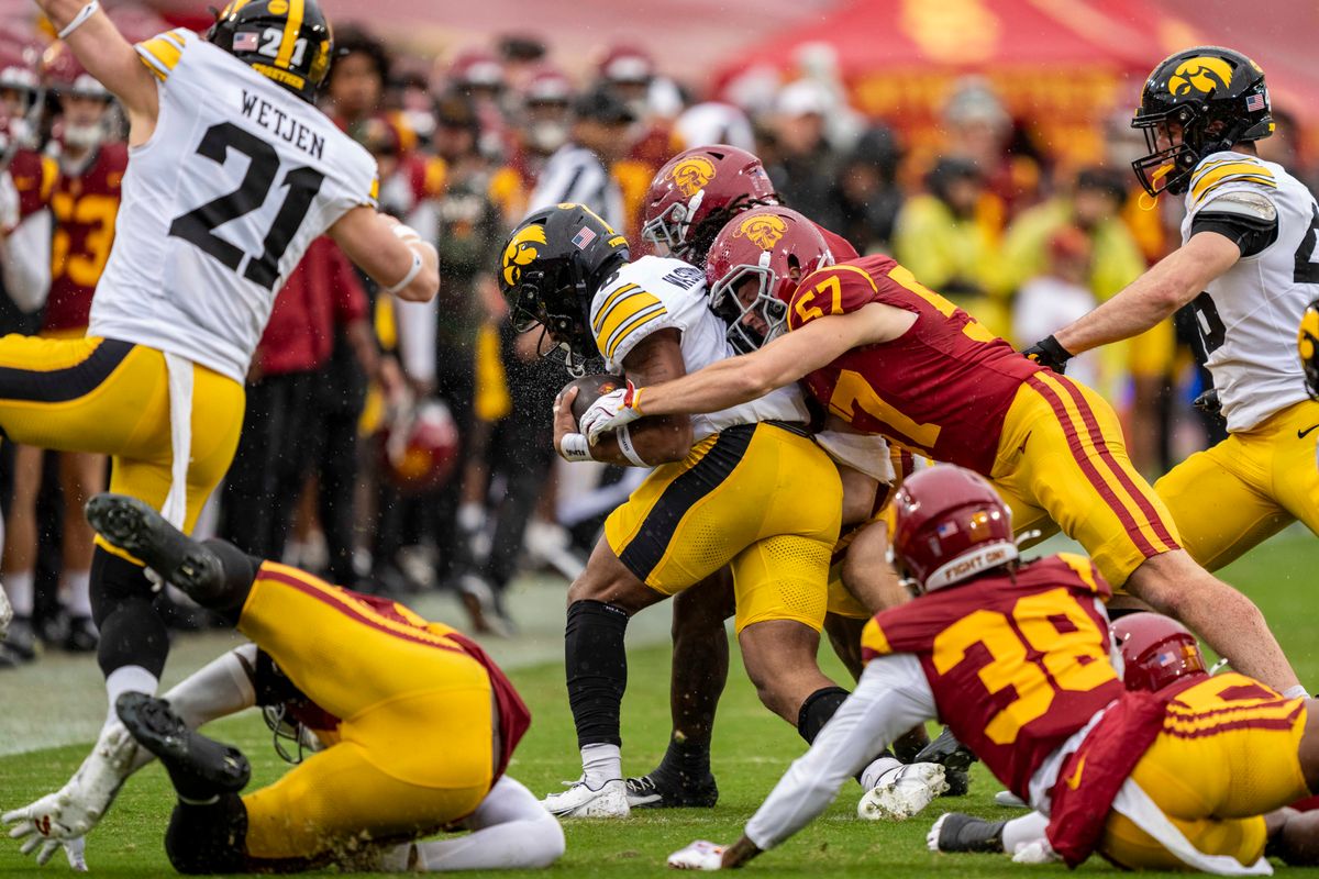 USC Trojans linebacker, Roman Marchetti (57) tackles an opponent during an NCAAF football game against the Iowa Hawkeyes on November 15, 2025 in Los Angeles, CA. USC Trojans linebacker, Roman Marchetti (57) tackles an opponent during an NCAAF football game against the Iowa Hawkeyes on November 15, 2025 in Los Angeles, CA.