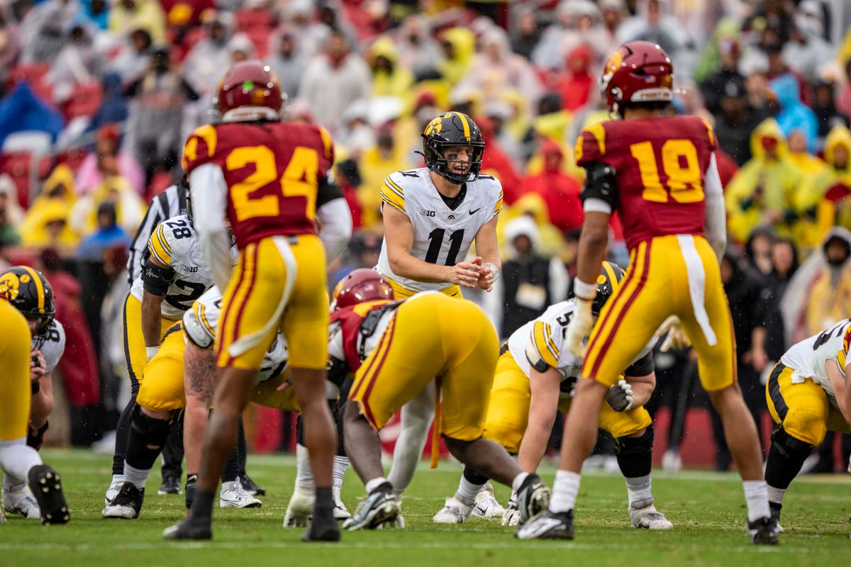 Iowa Hawkeyes quarterback, Mark Gronowski (11) awaits the snap during an NCAAF football game against the USC Trojans on November 15, 2025 in Los Angeles, CA. Iowa Hawkeyes quarterback, Mark Gronowski (11) awaits the snap during an NCAAF football game against the USC Trojans on November 15, 2025 in Los Angeles, CA.