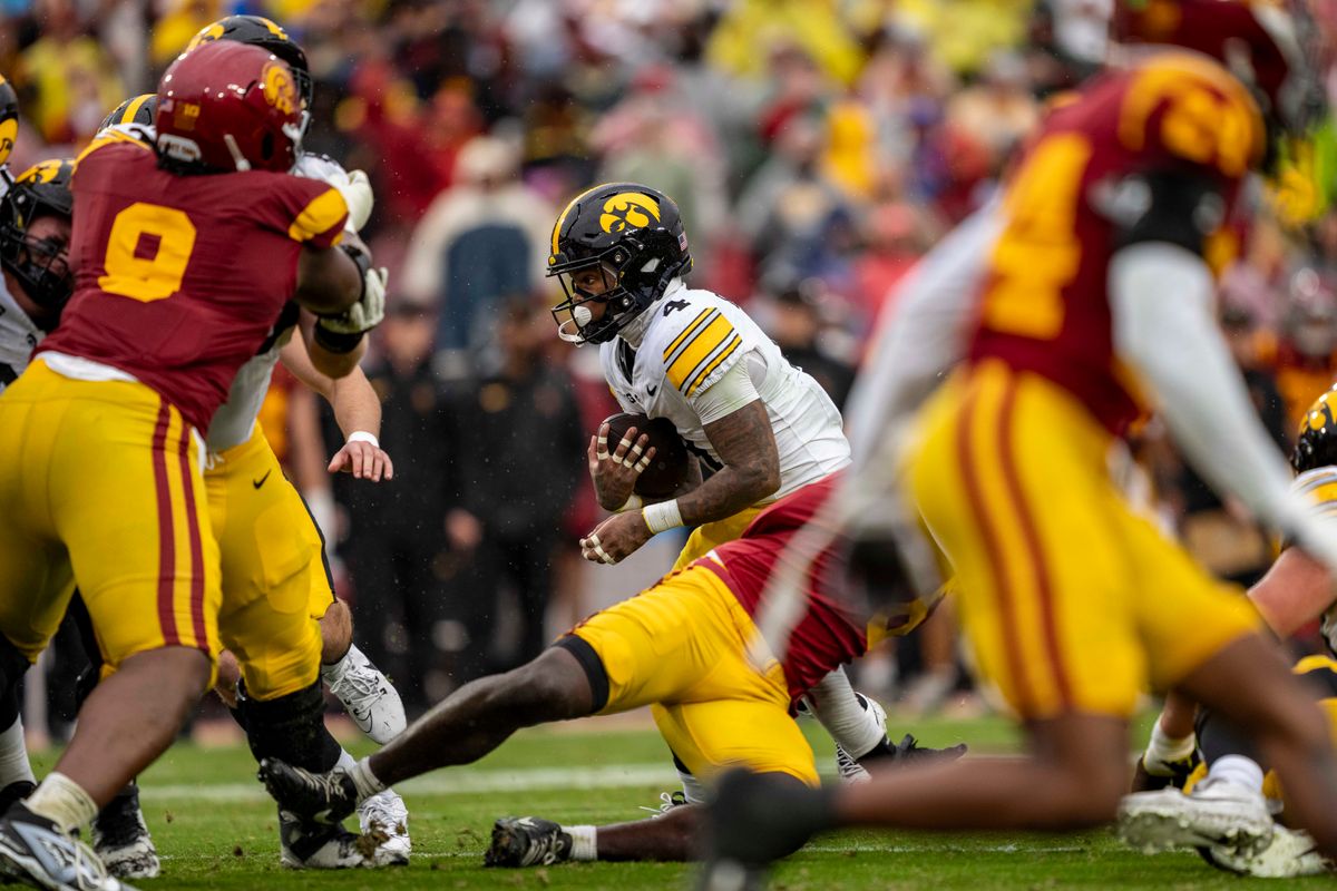Iowa Hawkeyes running back, Jazuin Patterson (4) breaks a tackle during an NCAAF football game against the USC Trojans on November 15, 2025 in Los Angeles, CA. Iowa Hawkeyes running back, Jazuin Patterson (4) breaks a tackle during an NCAAF football game against the USC Trojans on November 15, 2025 in Los Angeles, CA.