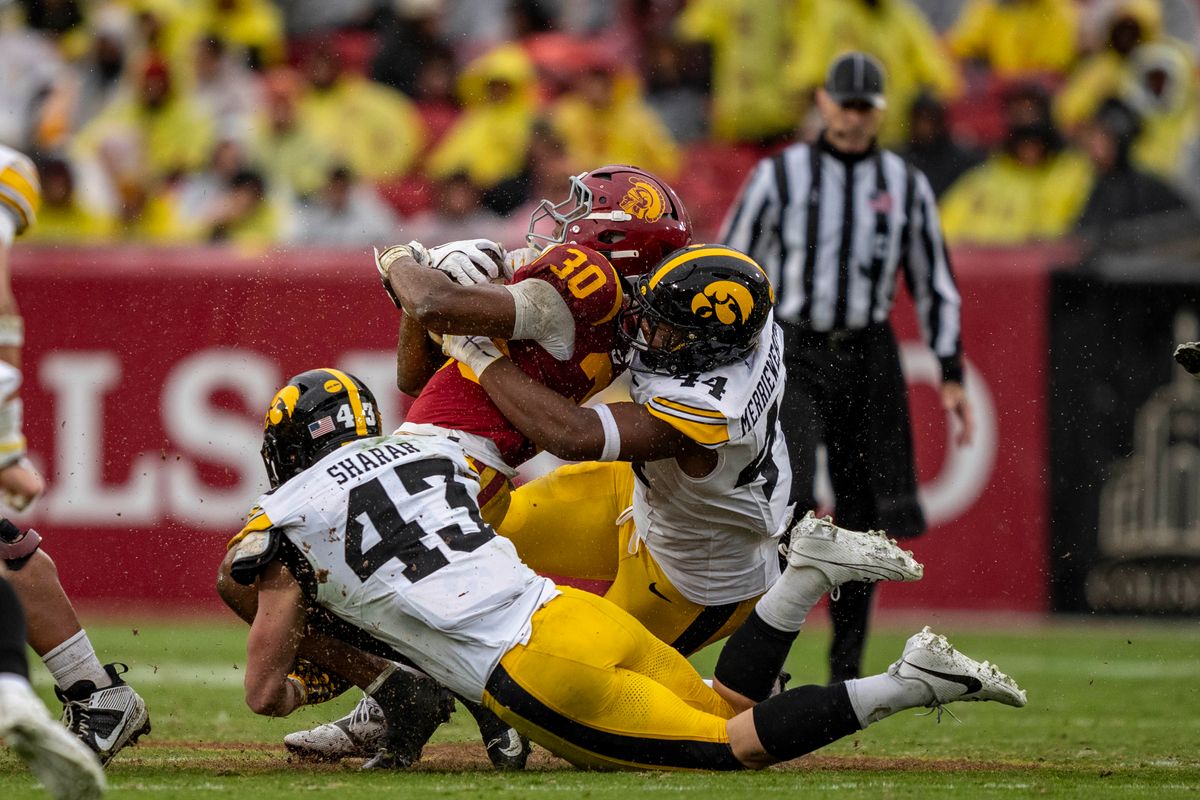 USC Trojans running back, King Miller (30) is tackled by an opponent during an NCAAF football game against the Iowa Hawkeyes on November 15, 2025 in Los Angeles, CA. USC Trojans running back, King Miller (30) is tackled by an opponent during an NCAAF football game against the Iowa Hawkeyes on November 15, 2025 in Los Angeles, CA.