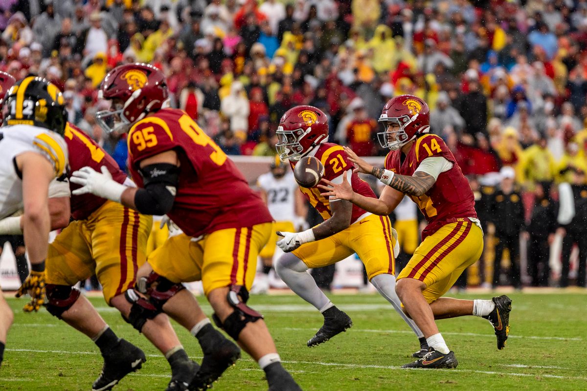 USC Trojans quarterback, Jayden Maiava (14) receives a snap during an NCAAF football game against the Iowa Hawkeyes on November 15, 2025 in Los Angeles, CA. USC Trojans quarterback, Jayden Maiava (14) receives a snap during an NCAAF football game against the Iowa Hawkeyes on November 15, 2025 in Los Angeles, CA.