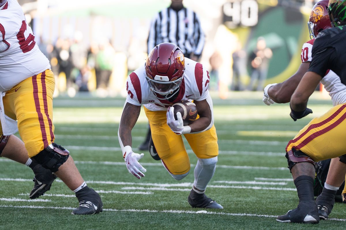 USC Trojans running back, King Miller (30) runs through the middle during an NCAAF football game against the Oregon Ducks on November 22, 2025 in Eugene, OR. USC Trojans running back, King Miller (30) runs through the middle during an NCAAF football game against the Oregon Ducks on November 22, 2025 in Eugene, OR.
