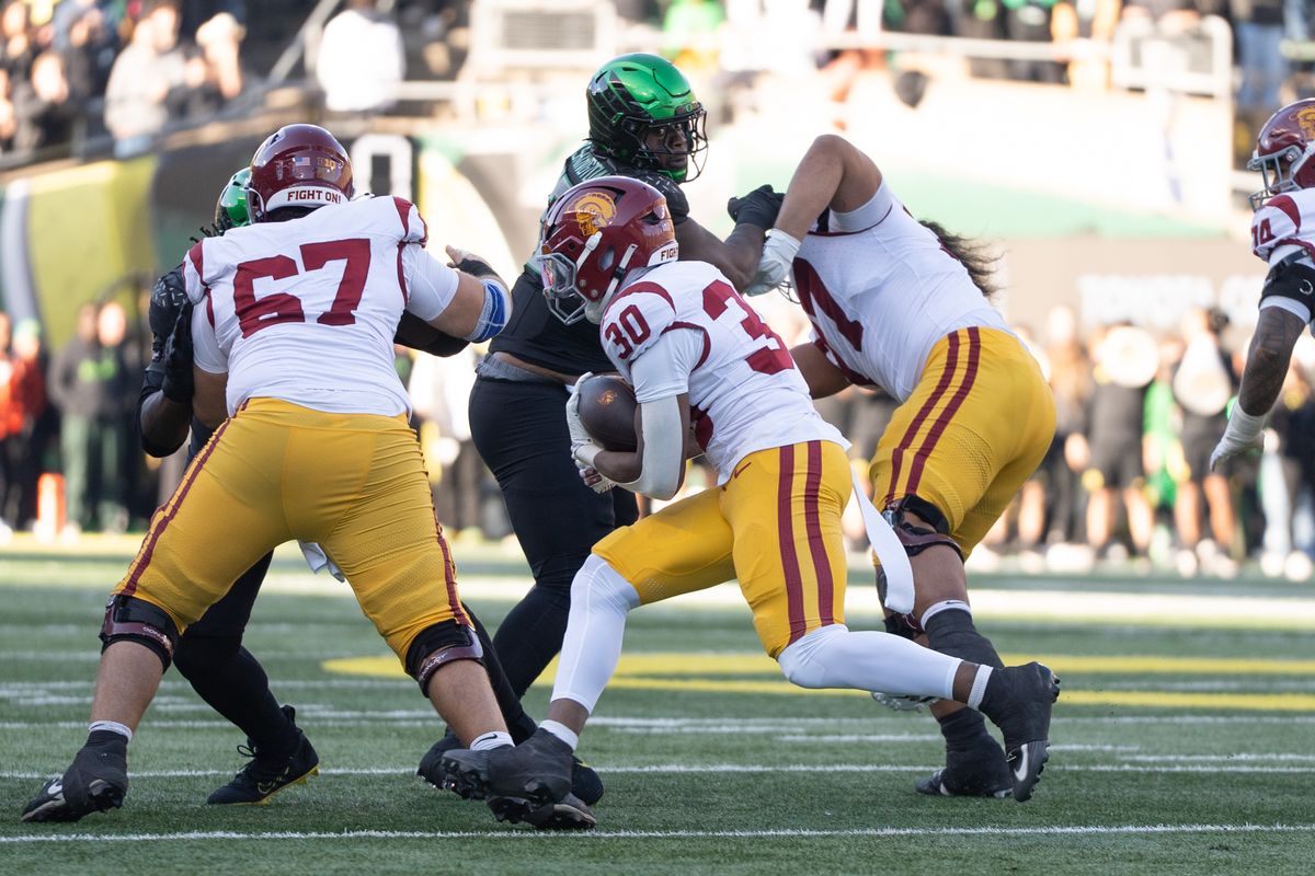 USC Trojans wide running back, King Miller (30) finds a gap and runs through it during an NCAAF football game against the Oregon Ducks on November 22, 2025 in Eugene, OR. USC Trojans wide running back, King Miller (30) finds a gap and runs through it during an NCAAF football game against the Oregon Ducks on November 22, 2025 in Eugene, OR.
