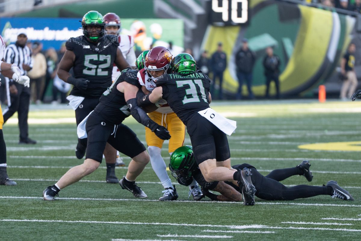 USC Trojans running back gets smothered by three defender's during an NCAAF football game against the Oregon Ducks on November 22, 2025 in Eugene, OR. USC Trojans running back gets smothered by three defender's during an NCAAF football game against the Oregon Ducks on November 22, 2025 in Eugene, OR.