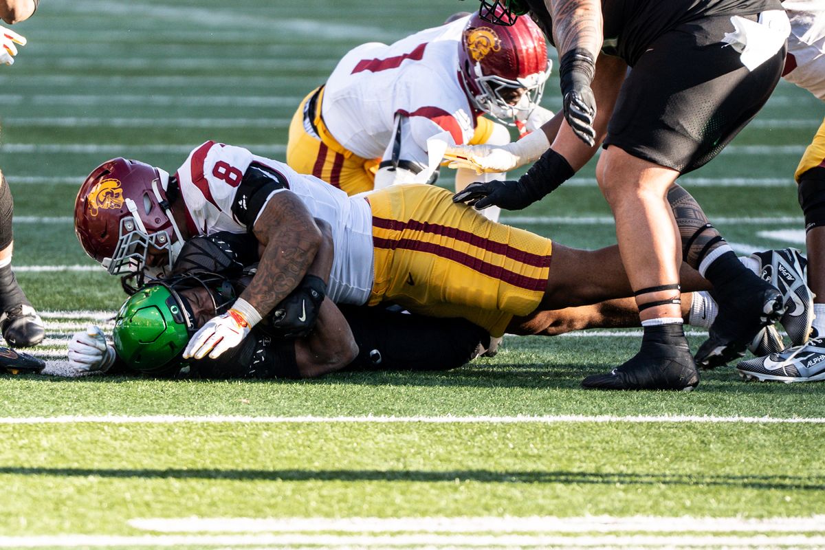 USC Trojans defensive tackle, Devan Thompkins (8) tackles the running back during an NCAAF football game against the Oregon Ducks on November 22, 2025 in Eugene, OR. USC Trojans defensive tackle, Devan Thompkins (8) tackles the running back during an NCAAF football game against the Oregon Ducks on November 22, 2025 in Eugene, OR.