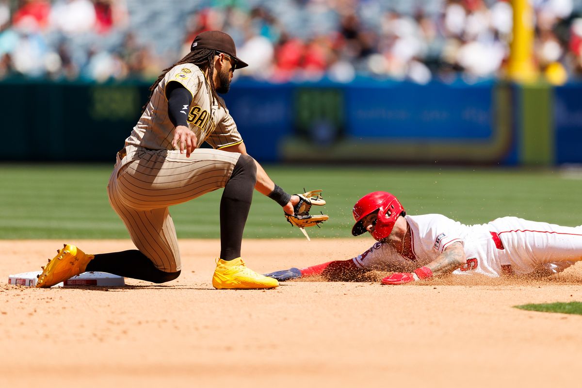 Zach Neto #9 of the Los Angeles Angels slides into second base against Fernando Tatis Jr. #23 of the San Diego Padres during the game at Angel Stadium of Anaheim on April 19, 2026 in Anaheim, California. Zach Neto #9 of the Los Angeles Angels slides into second base against Fernando Tatis Jr. #23 of the San Diego Padres during the game at Angel Stadium of Anaheim on April 19, 2026 in Anaheim, California.