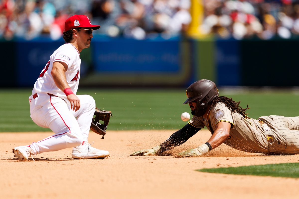 Fernando Tatis Jr. #23 of the San Diego Padres slides into second base against Adam Frazier #20 of the Los Angeles Angels during the game at Angel Stadium of Anaheim on April 19, 2026 in Anaheim, California. Fernando Tatis Jr. #23 of the San Diego Padres slides into second base against Adam Frazier #20 of the Los Angeles Angels during the game at Angel Stadium of Anaheim on April 19, 2026 in Anaheim, California.