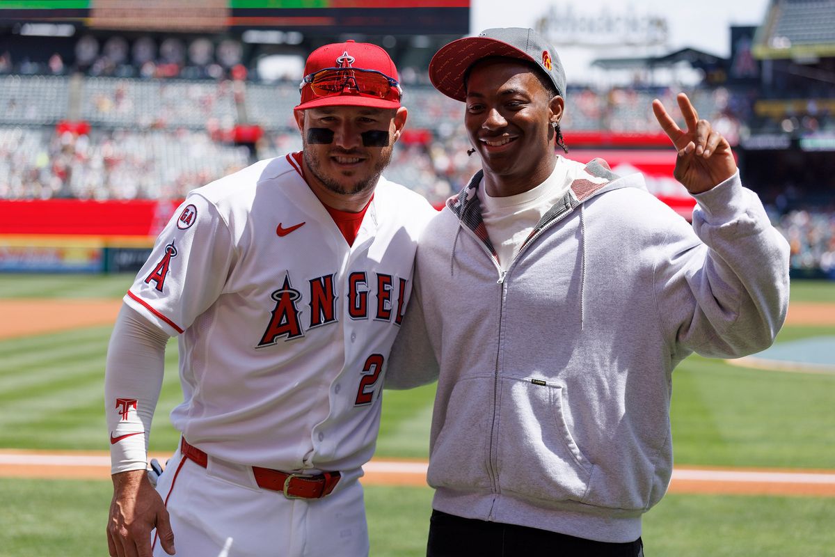 Mike Trout #27 of the Los Angeles Angels and King Miller of the USC Trojans pose for a photo before the game against the San Diego Padres at Angel Stadium of Anaheim on April 19, 2026 in Anaheim, California. Mike Trout #27 of the Los Angeles Angels and King Miller of the USC Trojans pose for a photo before the game against the San Diego Padres at Angel Stadium of Anaheim on April 19, 2026 in Anaheim, California.