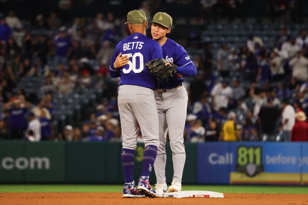 Los Angeles Dodgers infielder Mookie Betts (50) hugs Hyeseong Kim (6) after the MLB game against the Los Angeles Angels Friday May 15th, 2026 at Angel's Stadium in Anaheim, Calif. Los Angeles Dodgers infielder Mookie Betts (50) hugs Hyeseong Kim (6) after the MLB game against the Los Angeles Angels Friday May 15th, 2026 at Angel's Stadium in Anaheim, Calif.