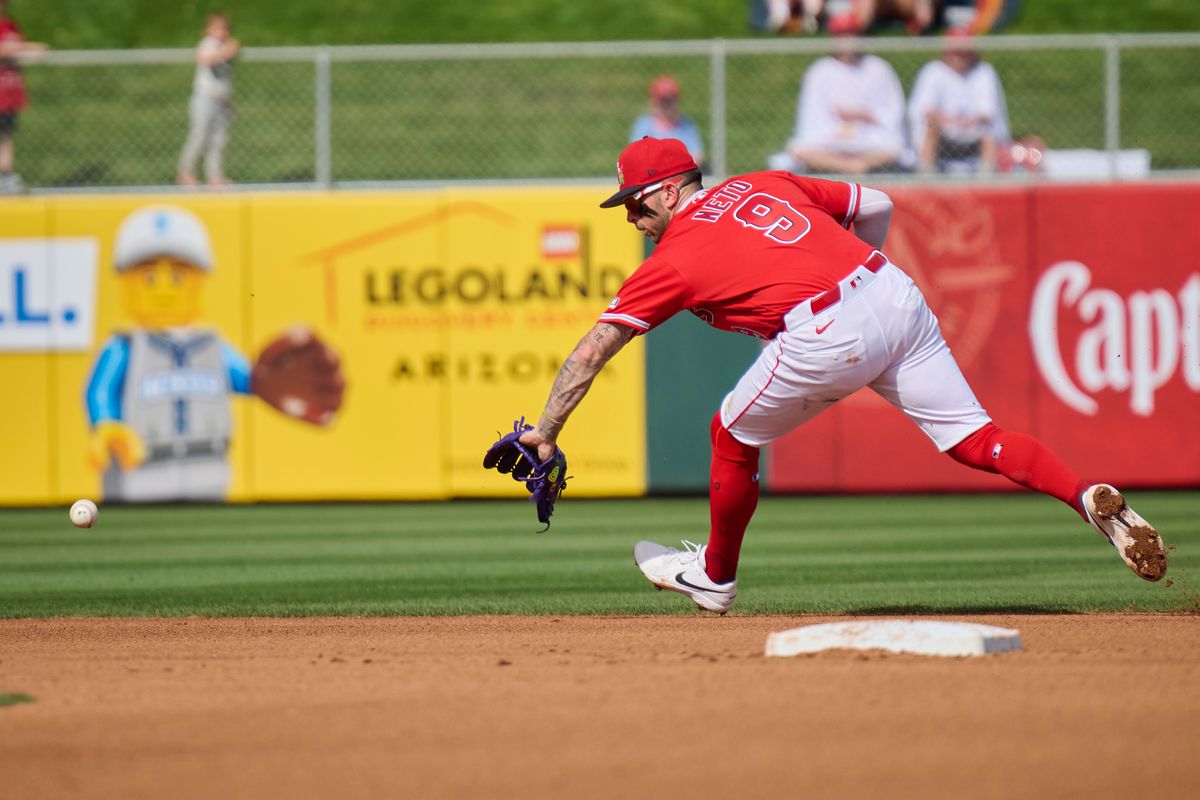 The Los Angeles Angels short stop Zach Neto (9) reaches for the ball against The Texas Rangers ,February 23rd, 2026 in Tempe Arizona. The Los Angeles Angels short stop Zach Neto (9) reaches for the ball against The Texas Rangers ,February 23rd, 2026 in Tempe Arizona.