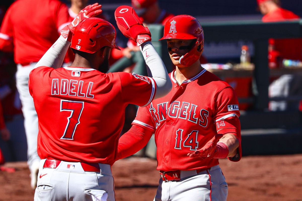 Los Angeles Angels OF Jo Adell (7) high fives his teammate C Logan O'Hoppe (14) after O'Hoppe hit a two-run home run against the Athletics on Sunday March 8, 2026, in Las Vegas, Nevada. Los Angeles Angels OF Jo Adell (7) high fives his teammate C Logan O'Hoppe (14) after O'Hoppe hit a two-run home run against the Athletics on Sunday March 8, 2026, in Las Vegas, Nevada.