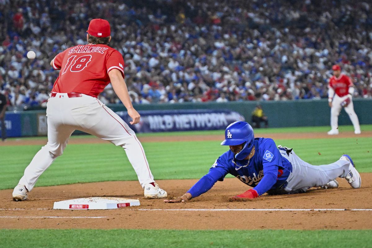 The Los Angeles Dodgers short stop Mookie Betts (50) slides into first during a Spring Training Game against The Los Angeles Angels, March 22nd, 2026 in Anaheim, California. The Los Angeles Dodgers short stop Mookie Betts (50) slides into first during a Spring Training Game against The Los Angeles Angels, March 22nd, 2026 in Anaheim, California.